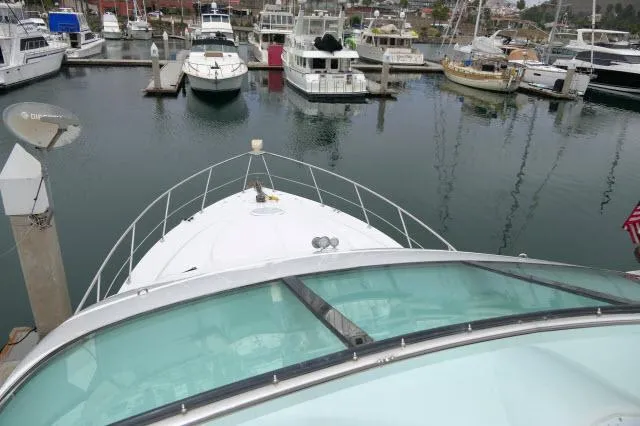 Slide: The Image of 2001 Carver 530 Voyager Pilothouse yacht docked at a marina. - 44