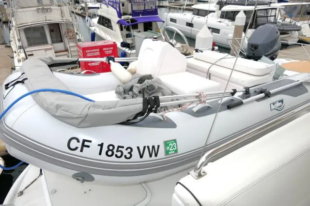 Slide: The Image of 2001 Carver 530 Voyager Pilothouse docked with inflatable dinghy, registration CF 1853 VW. - 45