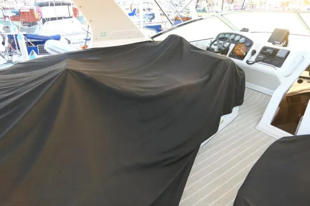 Slide: The Image of 2001 Carver 530 Voyager Pilothouse cockpit covered, docked in marina. - 49