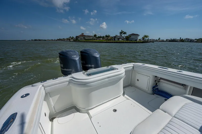 Slide: The Image of 2015 Yellowfin 32 boat with twin outboard motors on a sunny day. - 21