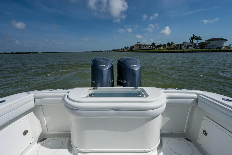 Slide: The Image of 2015 Yellowfin 32 boat with twin outboard engines on a sunny day. - 22
