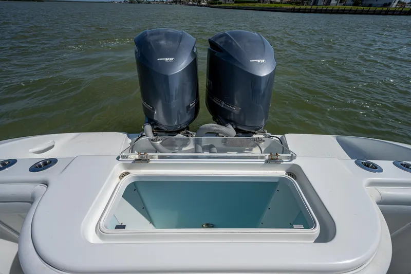 Slide: The Image of 2015 Yellowfin 32 boat with twin outboard engines on the water. - 23