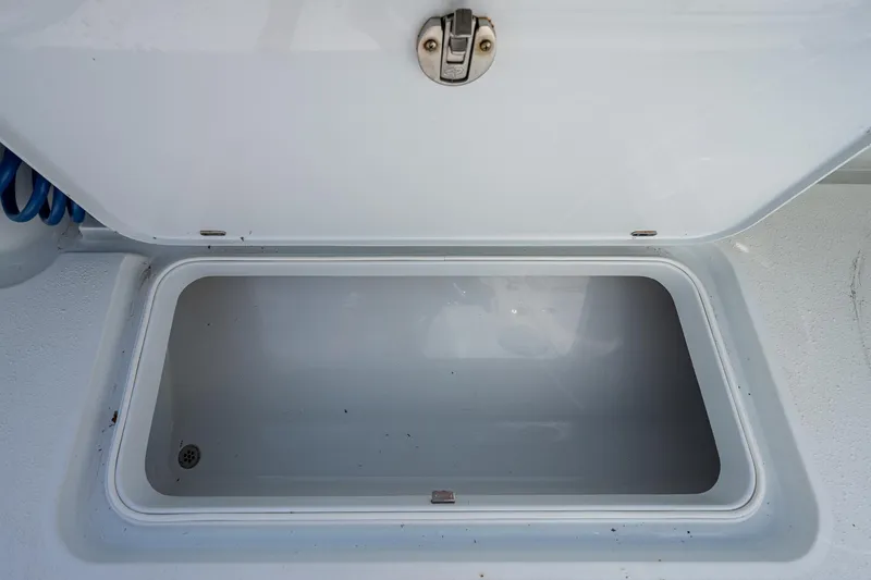 Slide: The Image of Open storage compartment on a 2015 Yellowfin 32 boat. - 25