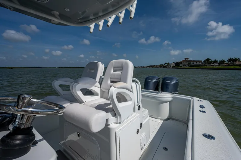 Slide: The Image of 2015 Yellowfin 32 boat with dual seats and twin engines on a sunny day. - 29