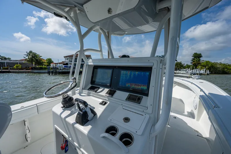 Slide: The Image of 2015 Yellowfin 32 boat console with navigation screens and controls. - 6