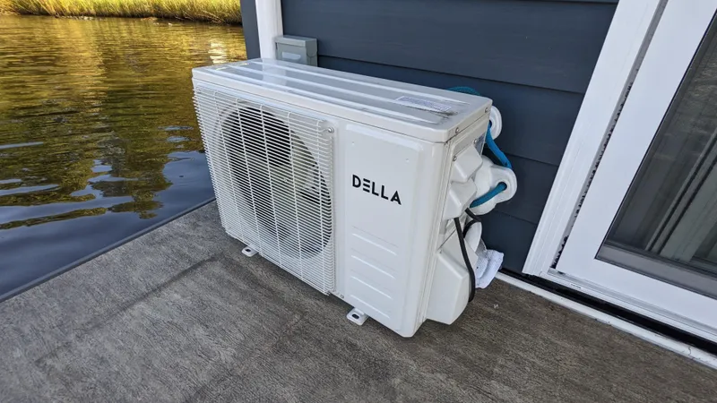 Slide: The Image of Della air conditioning unit on 2022 Houseboat 36' A&M Manufacturing deck. - 19