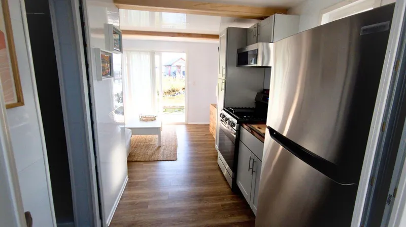 Slide: The Image of Modern kitchen interior of 2022 Houseboat 36' A&M Manufacturing, featuring stainless steel appliances. - 8
