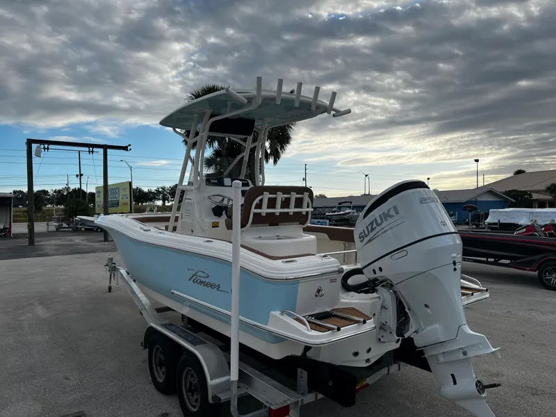 Slide: The Image of 2024 Pioneer 222 Sportfish boat with Suzuki outboard motor on trailer. - 15