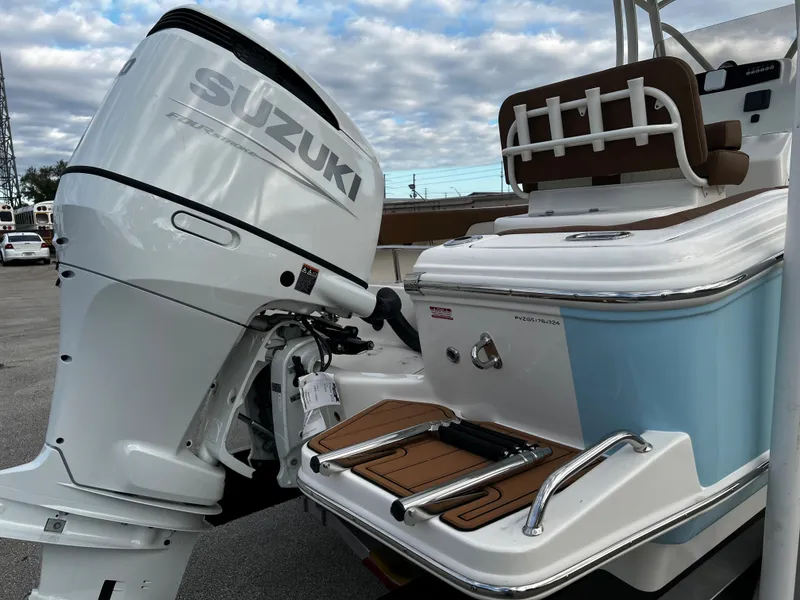 Slide: The Image of 2024 Pioneer 222 Sportfish boat with Suzuki outboard motor. - 21