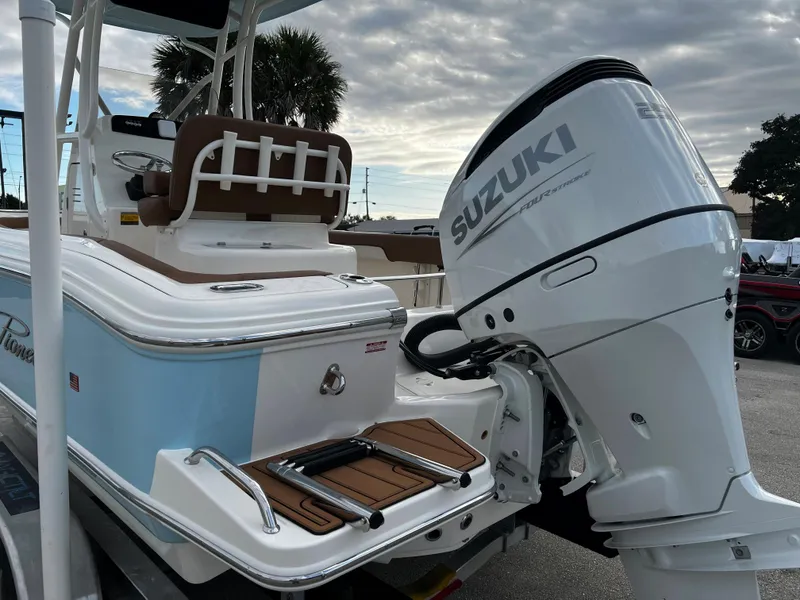 Slide: The Image of 2024 Pioneer 222 Sportfish boat with Suzuki outboard motor. - 22