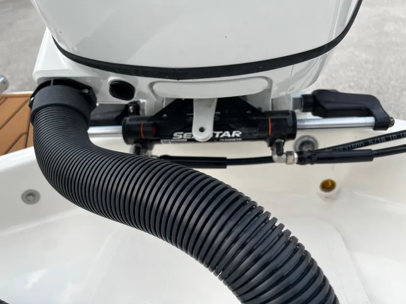 Slide: The Image of Close-up of the engine and hydraulic steering system on a 2024 Pioneer 222 Sportfish boat. - 35