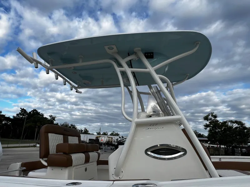 Slide: The Image of 2024 Pioneer 222 Sportfish boat with T-top under a cloudy sky. - 37
