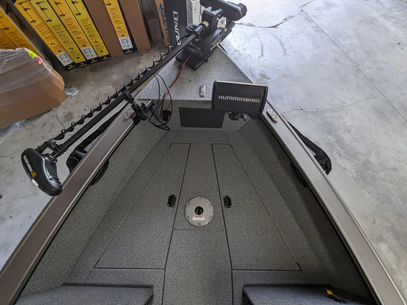 Slide: The Image of 2025 Lund 1875 Fisherman boat interior with Humminbird fish finder and trolling motor. - 10