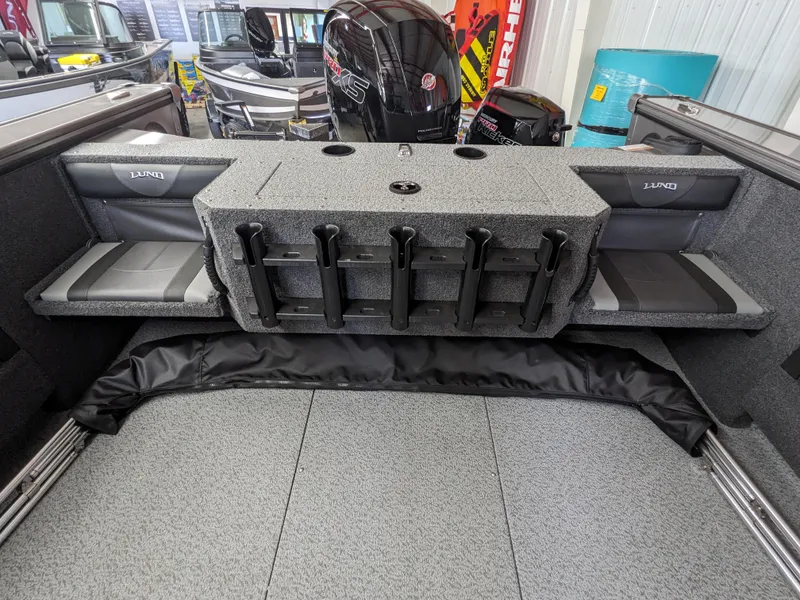 Slide: The Image of 2025 Lund 1875 Fisherman boat interior with rod holders and seating. - 4