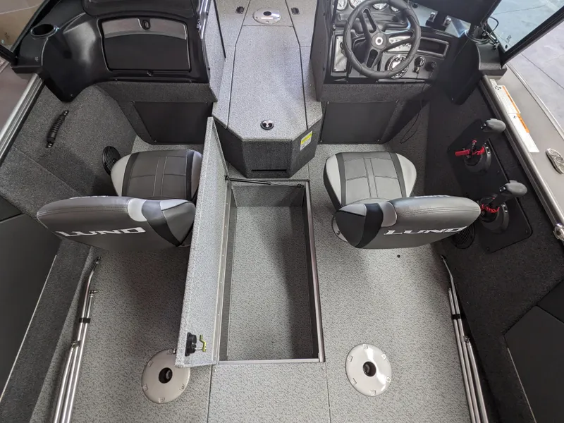 Slide: The Image of 2025 Lund 1875 Fisherman boat interior with seating and storage compartments. - 5