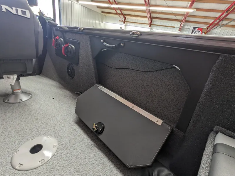 Slide: The Image of 2025 Lund 1875 Fisherman boat interior with storage compartment and seating. - 6