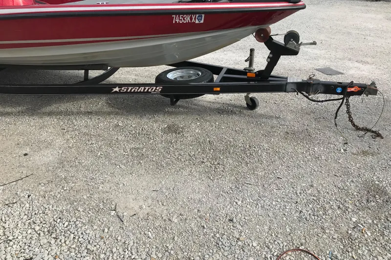 Slide: The Image of 2007 Stratos 285 XL boat trailer with red and white boat. - 18