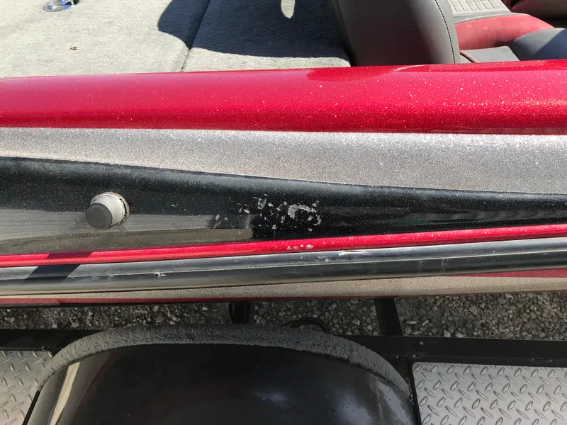 Slide: The Image of Close-up of a 2007 Stratos 285 XL boat with red and black detailing. - 20