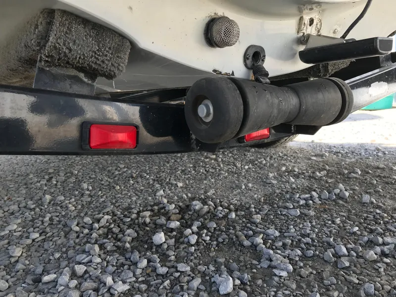 Slide: The Image of Close-up of a 2007 Stratos 285 XL boat trailer on gravel. - 21