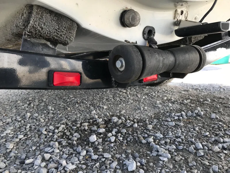 Slide: The Image of Close-up of 2007 Stratos 285 XL boat trailer hitch on gravel. - 23