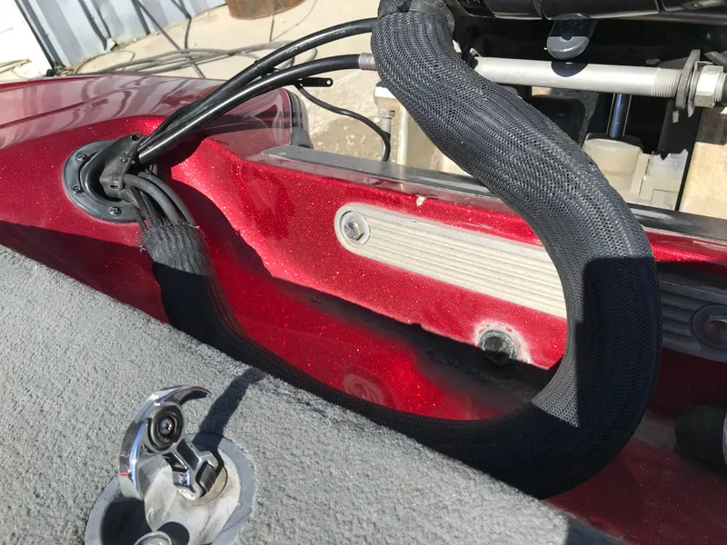 Slide: The Image of 2007 Stratos 285 XL boat interior with red finish and cable management. - 25