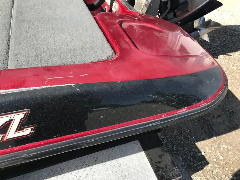 Slide: The Image of 2007 Stratos 285 XL boat, red and black detailing, close-up view. - 26