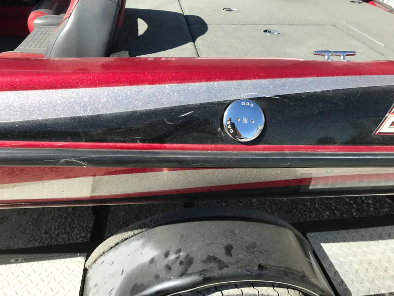 Slide: The Image of 2007 Stratos 285 XL boat with red and black detailing, gas cap visible. - 27