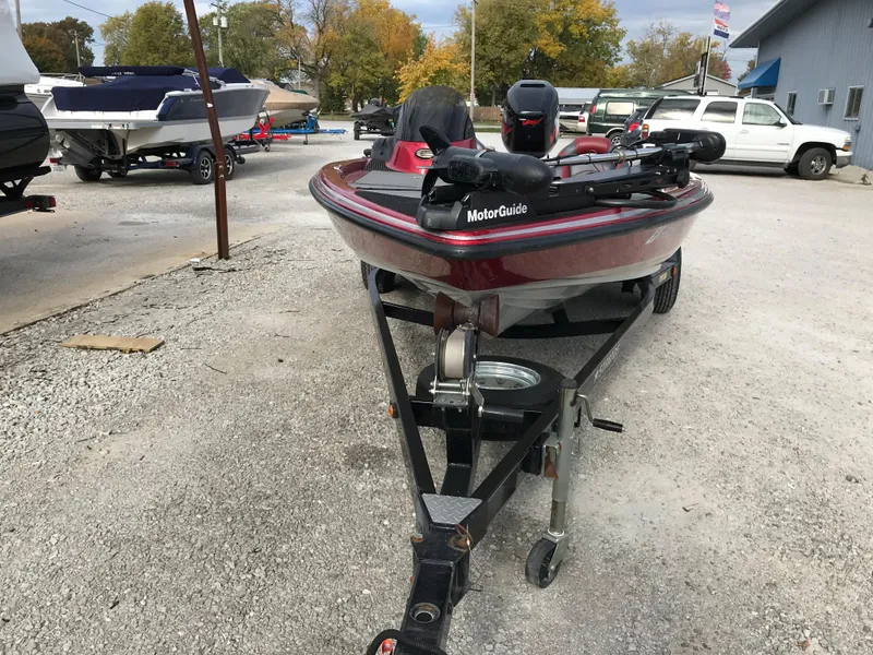 Slide: The Image of 2007 Stratos 285 XL boat on a trailer in a parking lot. - 3