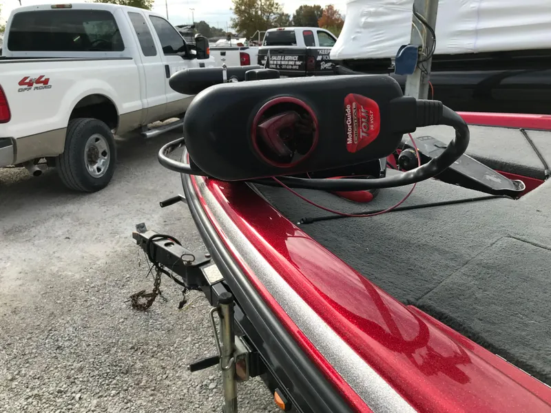 Slide: The Image of 2007 Stratos 285 XL boat with trolling motor in a parking lot. - 9
