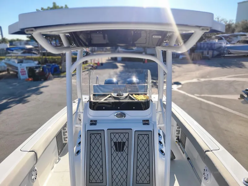 Slide: The Image of 2023 Wellcraft 242 Fisherman boat, center console view at marina. - 10