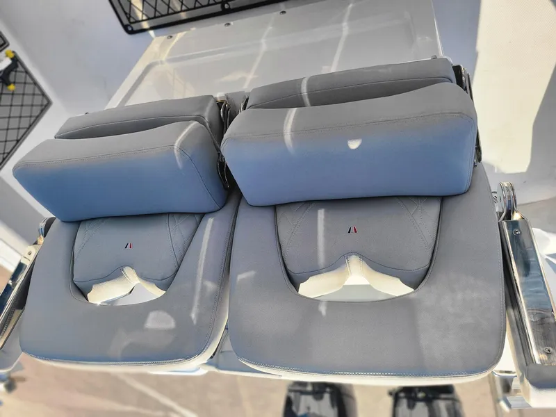 Slide: The Image of 2023 Wellcraft 242 Fisherman boat seats, gray upholstery, dual seating arrangement. - 13