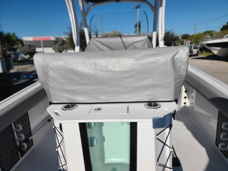 Slide: The Image of 2023 Wellcraft 242 Fisherman boat interior with covered seating and storage compartments. - 18