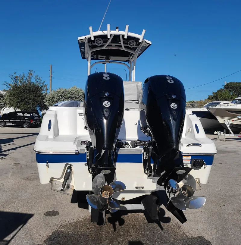 Slide: The Image of 2023 Wellcraft 242 Fisherman boat with dual outboard engines. - 21