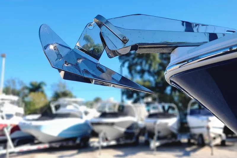 Slide: The Image of Close-up of 2023 Wellcraft 242 Fisherman boat anchor with other boats in the background. - 23