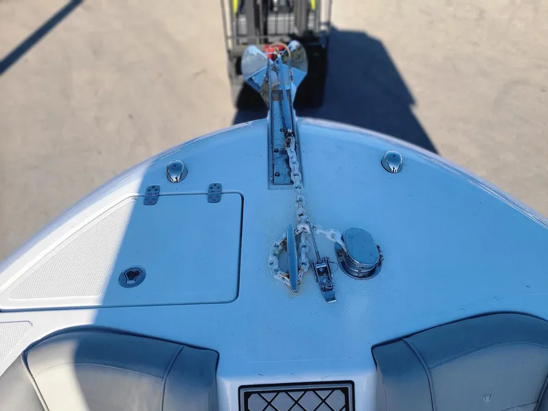 Slide: The Image of 2023 Wellcraft 242 Fisherman boat bow with anchor and storage compartments. - 9