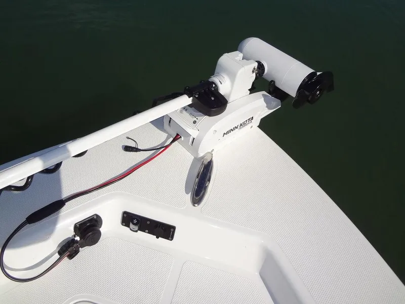 Slide: The Image of 2024 BlackJack 256 Bay boat with Minn Kota trolling motor on deck. - 13