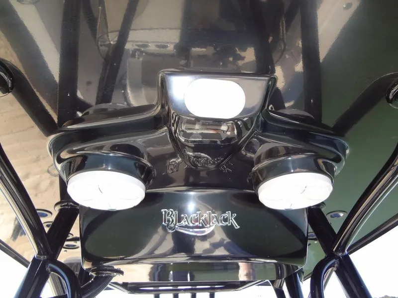 Slide: The Image of 2024 BlackJack 256 Bay boat console with sleek black design and modern lighting. - 26