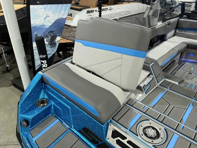 Slide: The Image of 2024 Supra SL boat interior with gray and blue seating, modern design. - 19
