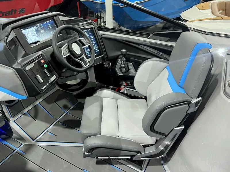 Slide: The Image of 2024 Supra SL boat interior with modern dashboard and ergonomic seating. - 23