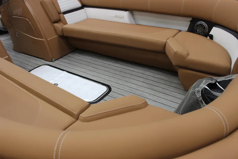 Slide: The Image of 2023 Harris Solstice DC 250 boat interior with tan leather seating and gray flooring. - 7