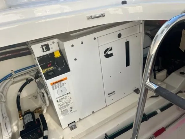 Slide: The Image of 2021 Tiara Yachts 38 LS engine compartment with Cummins Onan generator. - 14