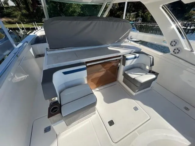 Slide: The Image of 2021 Tiara Yachts 38 LS interior with seating and table. - 4