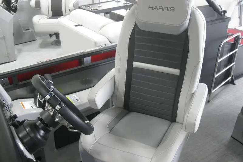 Slide: The Image of 2023 Harris FloteBote 250 Solstice interior with steering wheel and seating. - 17