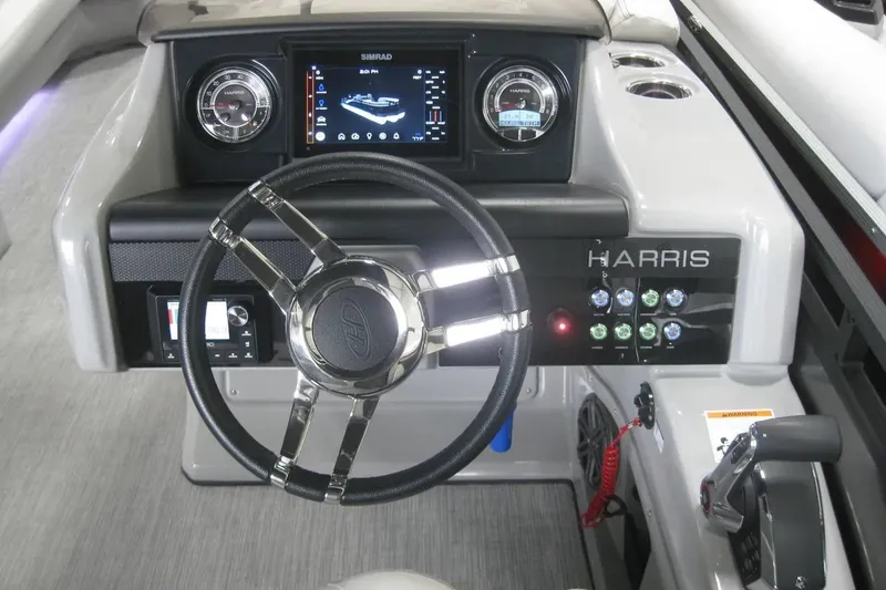 Slide: The Image of 2023 Harris FloteBote 250 Solstice captain's chair and steering wheel interior view. - 18