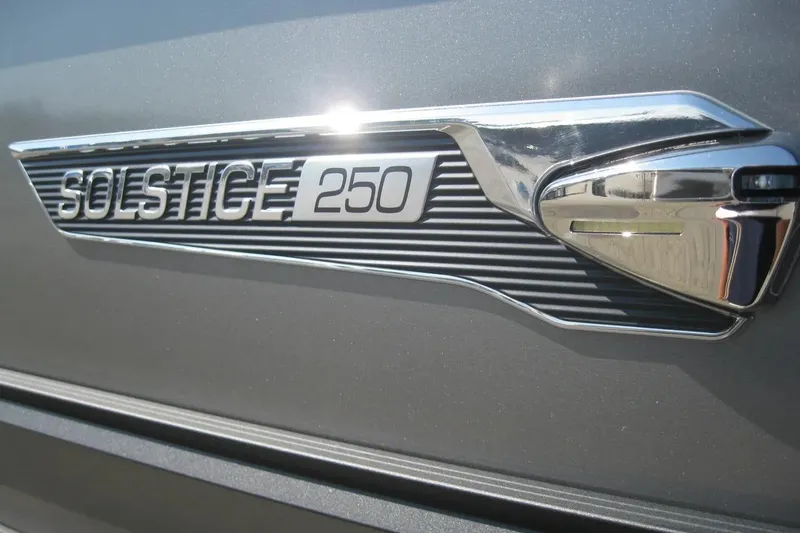 Slide: The Image of 2023 Harris FloteBote 250 Solstice pontoon boat on trailer, close-up view. - 3