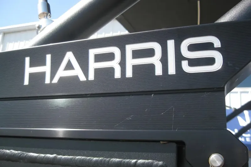 Slide: The Image of 2023 Harris FloteBote 250 Solstice emblem on sleek metallic surface. - 4