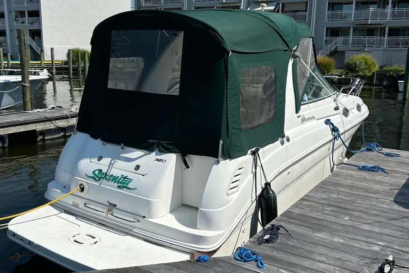 The Image of 2004 Sea Ray 260 DA boat docked with green canopy. - 1
