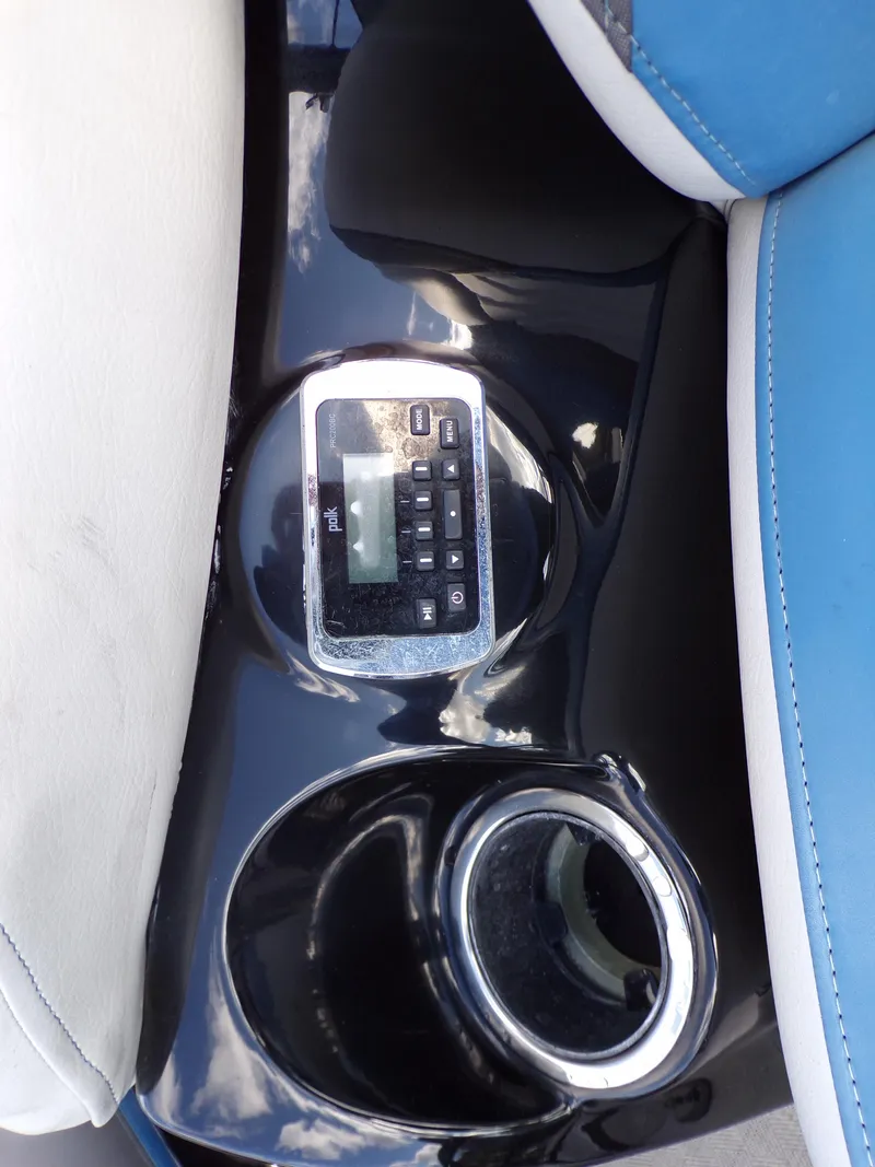 Slide: The Image of Control panel and cup holder on a 2018 Godfrey Aqua Padio 250 XP boat. - 15