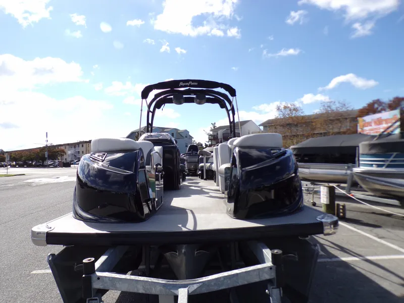 Slide: The Image of 2018 Godfrey Aqua Padio 250 XP pontoon boat on trailer in parking lot. - 2