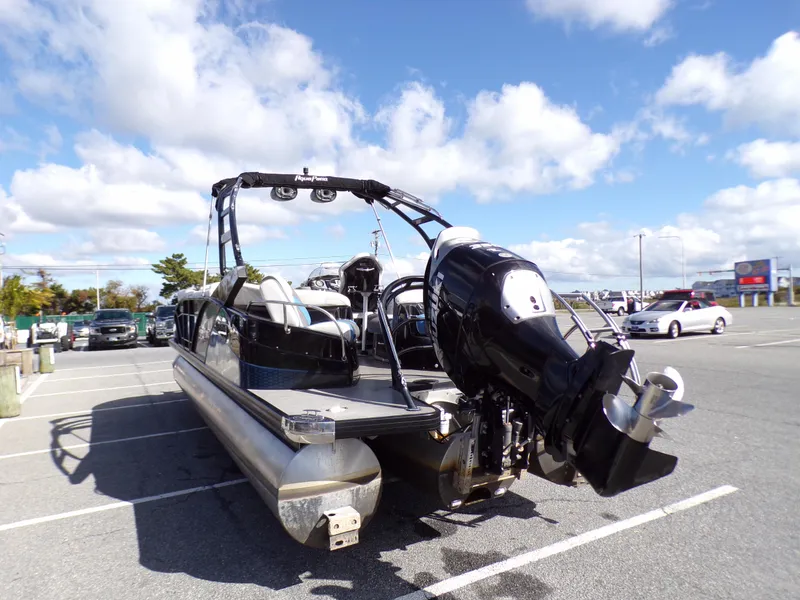 Slide: The Image of 2018 Godfrey Aqua Padio 250 XP pontoon boat in parking lot under blue sky. - 3